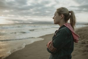 bereavement, Woman on a gloomy beach