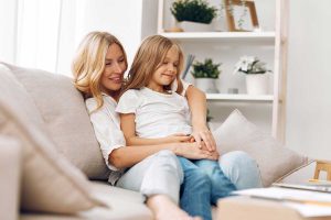 mum with her daughter on the sofa